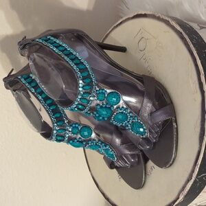 - Carlos Santana leather stilettos